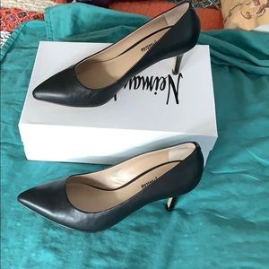 Black leather pumps